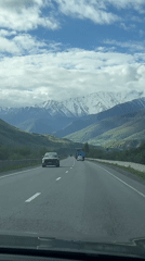 Highway traffic recorded near Chmi, Russia with mountain backdrop