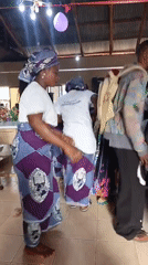Group dancing event featuring women in coordinated outfits