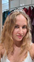 Woman tries on tiaras, takes selfies in Pula stores