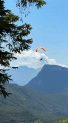 Summer morning in Molveno: paragliding, chairlifts, and Dolomite views