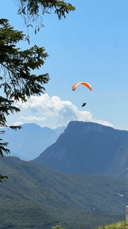 Summer morning in Molveno: paragliding, chairlifts, and Dolomite views