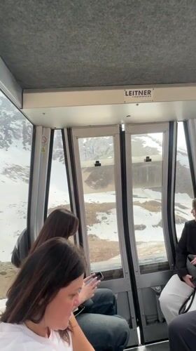 Tourists ride gondolas, photograph scenery at Kazakhstan ski resort