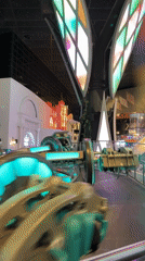Neon-lit indoor amusement rides at a Doha entertainment venue