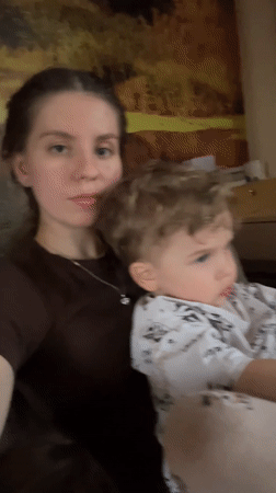 Mother and child share quiet moments on couch in Klin