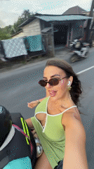 Woman films herself on motorbike ride in Kuta Selatan
