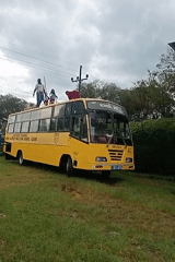 School bus roof maintenance observed in Kenya's Lugari district