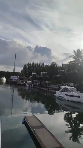 Ko Kaeo marina on a cloudy morning, yachts and waterfront resort