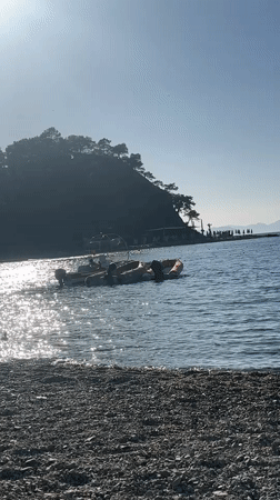 Family enjoys sunny afternoon at Fethiye beach