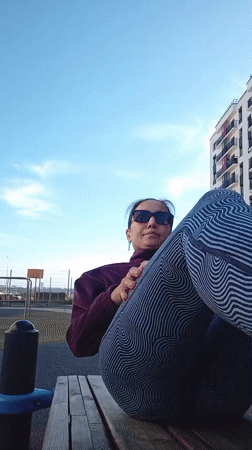 Woman performs early morning calisthenics workout in Pervomaysky, Russia