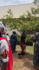Community gathering around white van in Bukuru, Nigeria