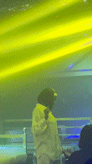Nigerian nightclub scene with DJ, dancers, and illuminated props