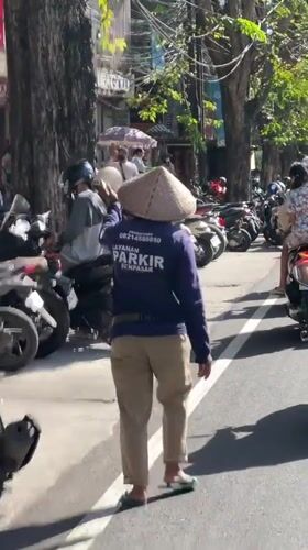 Morning street life observed across Denpasar, Indonesia
