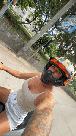 Scooter rider cruising through Ko Samui streets