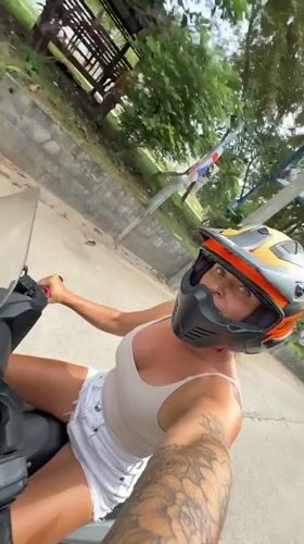 Scooter rider cruising through Ko Samui streets