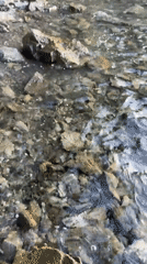 Water flows over rocks captured on Sithonia coastline
