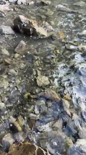 Water flows over rocks captured on Sithonia coastline