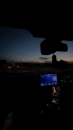 Nighttime driving scene captured from car interior in Great Yarmouth