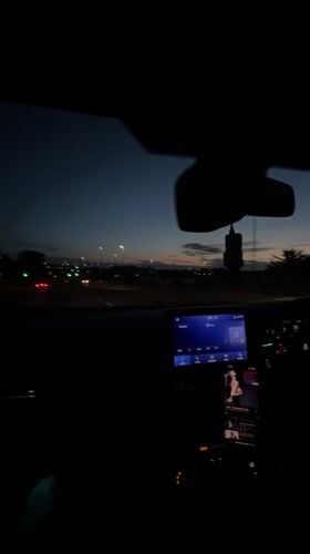 Nighttime driving scene captured from car interior in Great Yarmouth