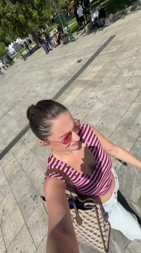 Woman films herself in Athens public square
