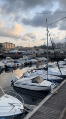 Boats docked at a busy working marina in Pasaia, Spain