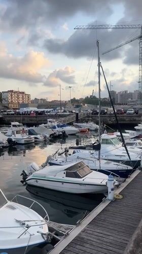 Boats docked at a busy working marina in Pasaia, Spain
