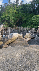 Tourists visit scenic rock formations at Ban Tai beach Thailand