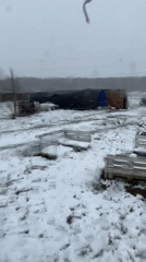 Spring snow blankets Russian village, military vehicle spotted