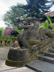 Pigeons and ancient stone sculptures captured in Pupuan, Indonesia