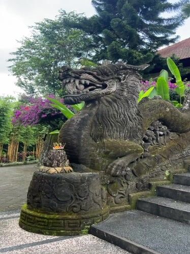 Pigeons and ancient stone sculptures captured in Pupuan, Indonesia