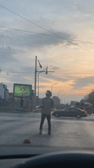 Street juggler performs with clubs in Sofia, Bulgaria