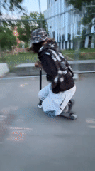 Scooter tricks performed at Lyon riverfront skatepark during evening