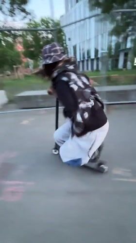 Scooter tricks performed at Lyon riverfront skatepark during evening