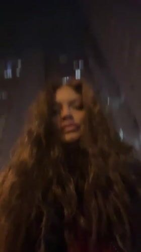 Woman photographed across Krasnogorsk locations, #BeatDrop graphics captured