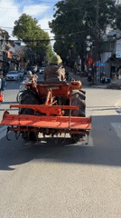 Tractor with rototiller spotted on city road in Đà Lạt