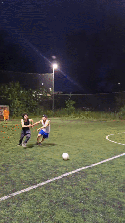 Evening soccer and sunset views along Kyiv's Dnipro River