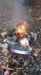 Ground fire burns amid trash and campaign debris in Akwanga