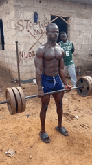 Outdoor weightlifting session documented in Akwanga, Nigeria residential area