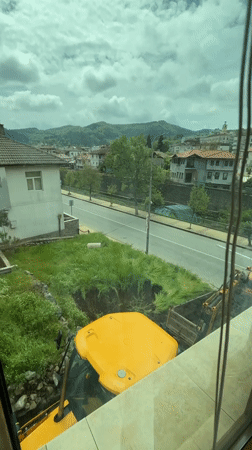Construction work underway in Zlatograd village with excavator