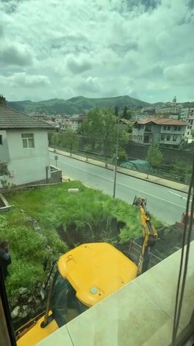 Construction work underway in Zlatograd village with excavator