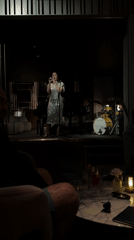 Woman performs on stage at London venue