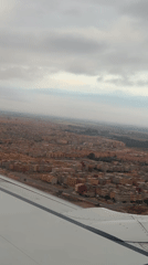 Passenger films aerial view of Marrakesh from airplane window