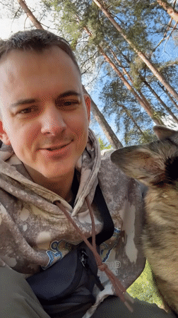 Person interacts with dog in Chuprino, Russia