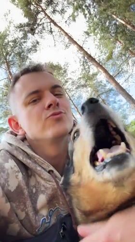 Person interacts with dog in Chuprino, Russia