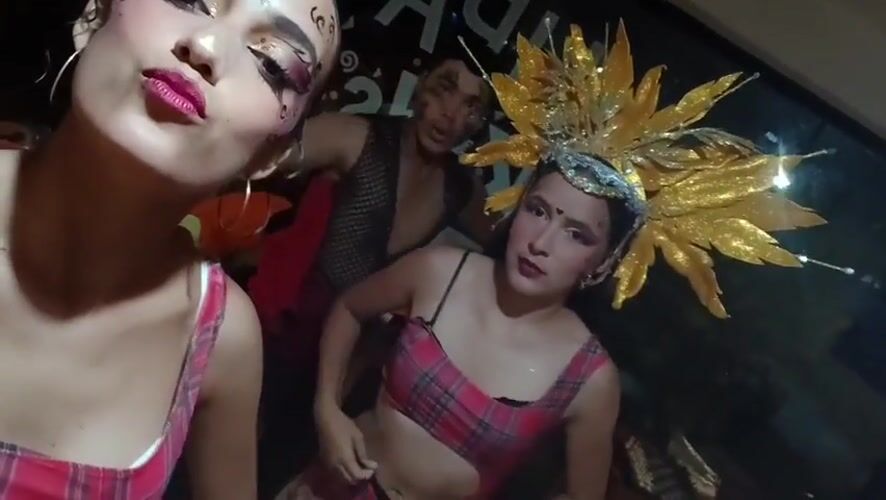 Friends take selfies with theatrical makeup in Venezuela beach town