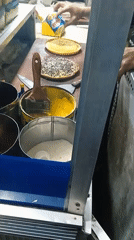 Street food prep and market activity in Banjarmasin