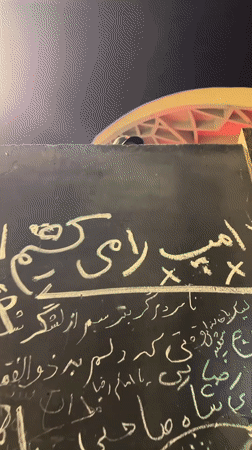 Graffiti-covered wall in Tehran includes anti-Trump message