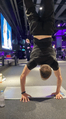 Man performs yoga routines at Murino gym