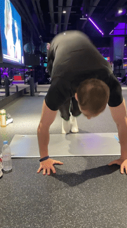 Man performs yoga routines at Murino gym