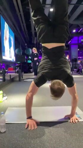 Man performs yoga routines at Murino gym