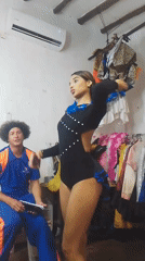Woman in costume dances, poses for selfies in room